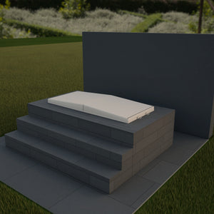 Render of an Omnitub Cover in Almond, closed on an Omnitub bath built into a raised graphite porcelain surround with two steps and a dark rendered wall behind