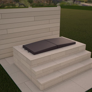 Render of an Omnitub Cover in Chestnut, closed on an Omnitub bath built into a raised warm-sand stone surround with two steps and pale board cladding behind