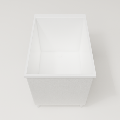 Omnitub Sheer 1100 deep soaking tub in white — 1100×700mm footprint, 600mm deep, end view, shown on feet, handmade in Britain [render:1_end_view:feet]