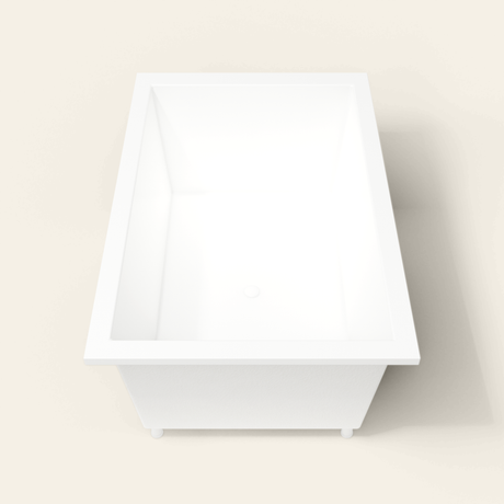 Omnitub 1600×1050 white deep soaking bath — end view, with feet [render:1_end_view:feet]
