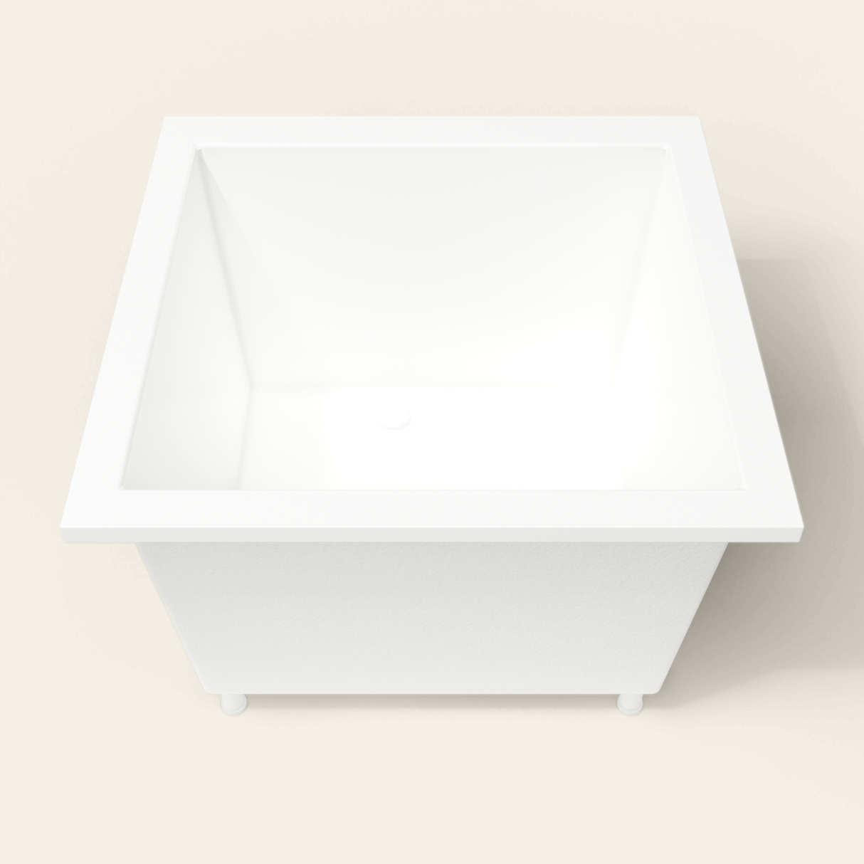 Omnitub 1050×1050 white deep soaking bath — end view, with feet [render:1_end_view:feet]