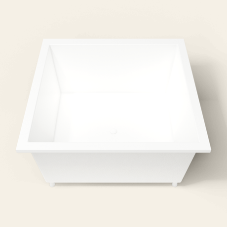 Omnitub 1400×1400 white deep soaking bath — end view, with feet [render:1_end_view:feet]