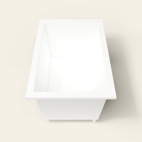 Omnitub 1400×900 white deep soaking bath — end view, with feet [render:1_end_view:feet]