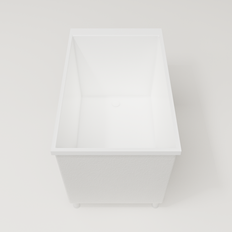 Omnitub Sheer 1200 deep soaking tub in white — 1200×700mm footprint, 600mm deep, end view, shown on feet, handmade in Britain [render:1_end_view:feet]