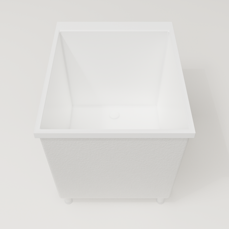 Omnitub Sheer 900 deep soaking tub in white — 900×700mm footprint, 600mm deep, end view, shown on feet, handmade in Britain [render:1_end_view:feet]