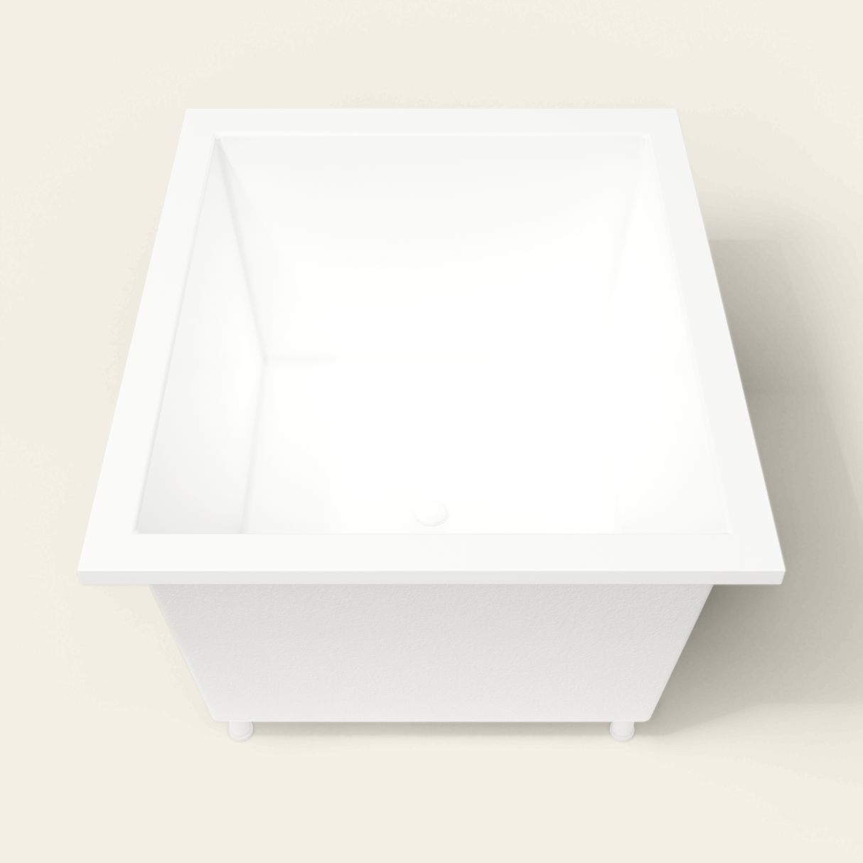 Omnitub 1250×1050 white deep soaking bath — end view, with feet [render:1_end_view:feet]