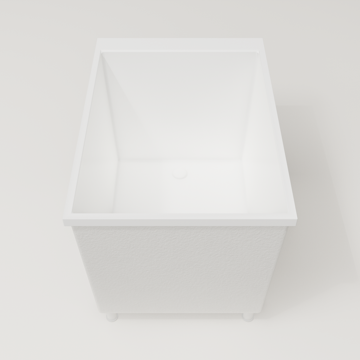 Omnitub Sheer 1000 deep soaking tub in white — 1000×700mm footprint, 600mm deep, end view, shown on feet, handmade in Britain [render:1_end_view:feet]