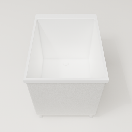 Omnitub Sheer 1000 deep soaking tub in white — 1000×700mm footprint, 600mm deep, end view, shown on feet, handmade in Britain [render:1_end_view:feet]