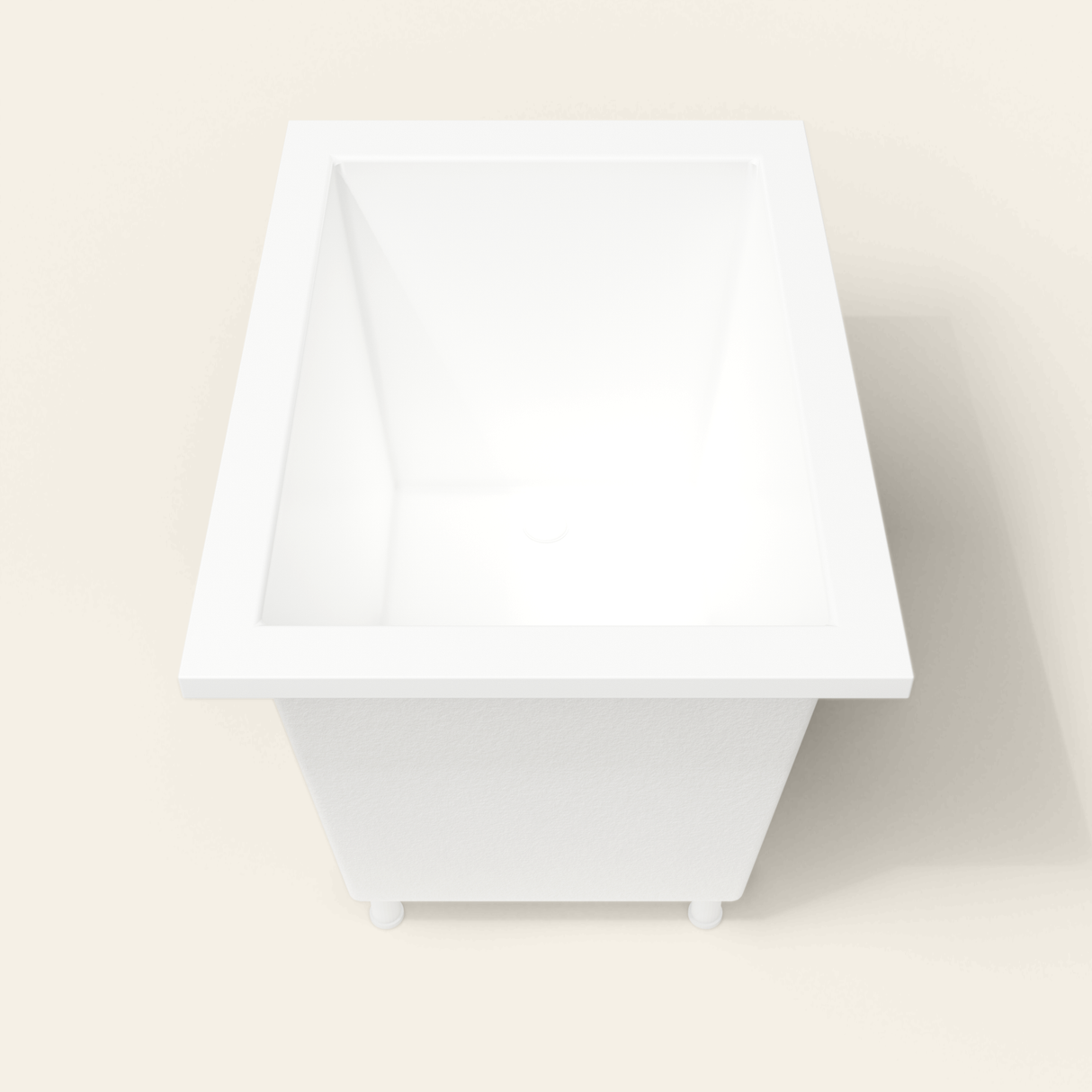 Omnitub 1050×750 white deep soaking bath — end view, with feet [render:1_end_view:feet]