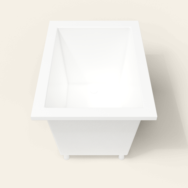 Omnitub 1050×750 white deep soaking bath — end view, with feet [render:1_end_view:feet]