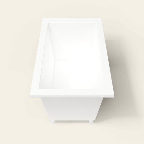 Omnitub 1250×750 white deep soaking bath — end view, with feet [render:1_end_view:feet]
