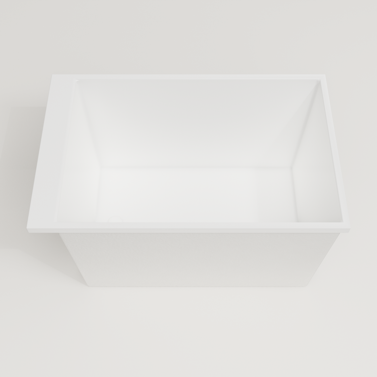 Omnitub Sheer 1100 deep soaking tub in white — 1100×700mm footprint, 600mm deep, looking into the deep well, handmade in Britain [render:3_deep_hero:nofeet]