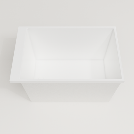 Omnitub Sheer 1100 deep soaking tub in white — 1100×700mm footprint, 600mm deep, looking into the deep well, handmade in Britain [render:3_deep_hero:nofeet]