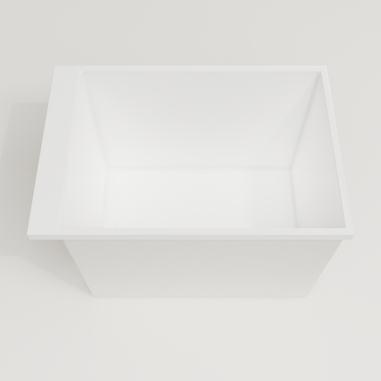 Omnitub Sheer 1000 deep soaking tub in white — 1000×700mm footprint, 600mm deep, looking into the deep well, handmade in Britain [render:3_deep_hero:nofeet]