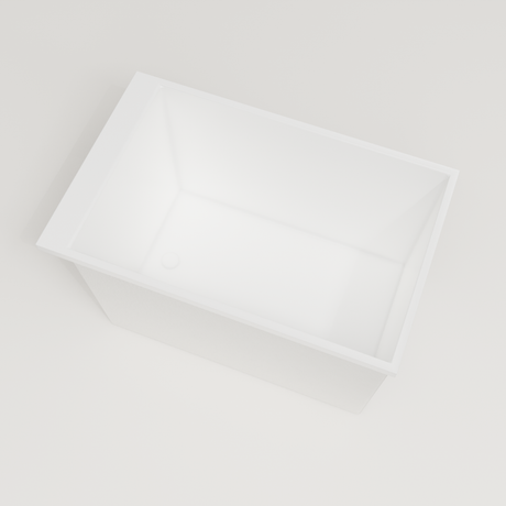 Omnitub Sheer 1100 deep soaking tub in white — 1100×700mm footprint, 600mm deep, steep near-vertical wall, handmade in Britain [render:4_steep_into_well:nofeet]