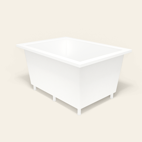 Omnitub 1300×950 white deep soaking bath — three-quarter, with feet [render:6_grounded:feet]