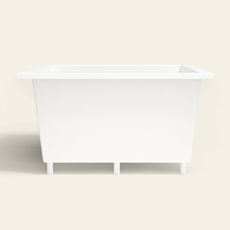 Omnitub 1250×1050 white deep soaking bath — side profile, with feet [render:7_long_side:feet]