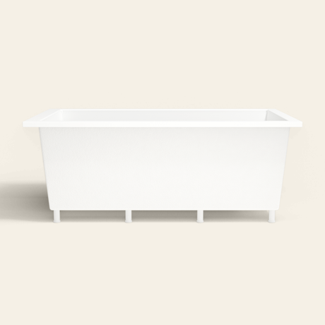 Omnitub 1800×1050 white deep soaking bath — side profile, with feet [render:7_long_side:feet]