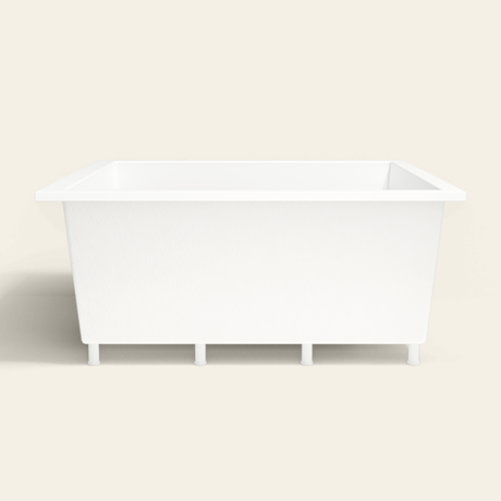 Omnitub 1600×1600 white deep soaking bath — side profile, with feet [render:7_long_side:feet]