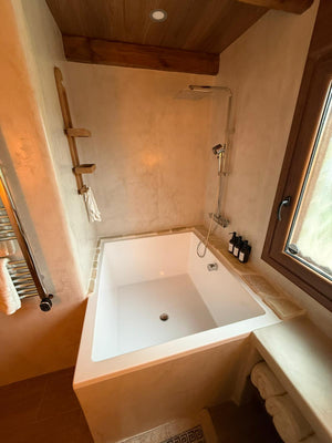Omnitub 1400 x 1200 deep soaking tub 600mm depth wide rectangular - installed in bathroom