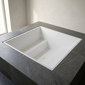 1800 × 1800 mm multi-person deep soaking tub by Omnitub — six-adult capacity, handmade in Somerset, England