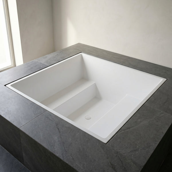 1800 × 1800 mm multi-person deep soaking tub by Omnitub — six-adult capacity, handmade in Somerset, England