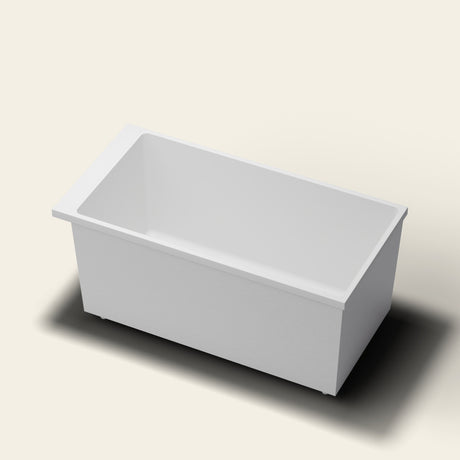 Omnitub Sheer 1400 deep soaking tub in white — 1400×700mm footprint, 600mm deep, near-vertical walls, hand-polished Omnigel, on adjustable feet — hero [render:hero:feet]
