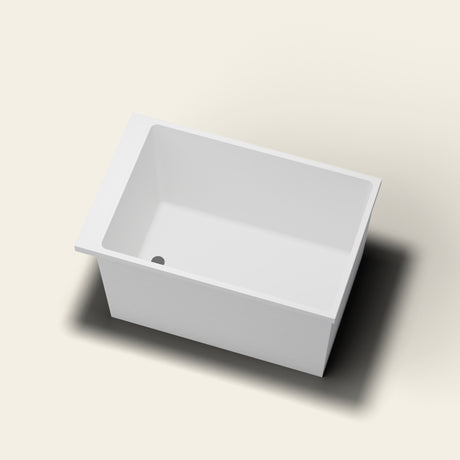 Omnitub Sheer 1100 deep soaking tub in white — 1100×700mm footprint, 600mm deep, near-vertical walls, hand-polished Omnigel — looking in [render:lookin:nofeet]