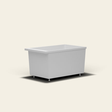 Omnitub Sheer 1200 deep soaking tub in white — 1200×700mm footprint, 600mm deep, near-vertical walls, hand-polished Omnigel, on adjustable feet — low angle [render:lowcorner:feet]