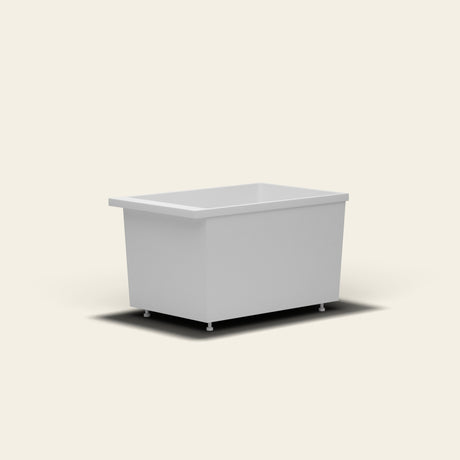 Omnitub Sheer 1100 deep soaking tub in white — 1100×700mm footprint, 600mm deep, near-vertical walls, hand-polished Omnigel, on adjustable feet — low angle [render:lowcorner:feet]