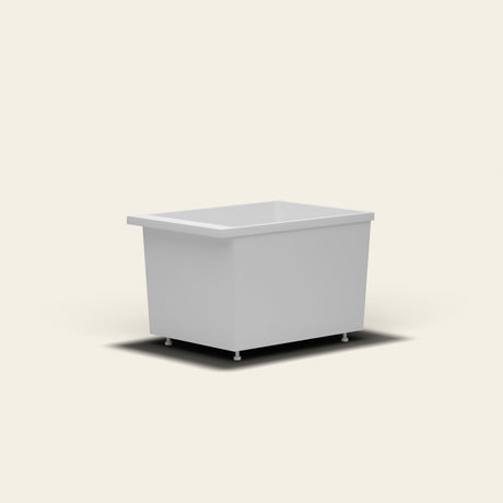 Omnitub Sheer 1000 deep soaking tub in white — 1000×700mm footprint, 600mm deep, near-vertical walls, hand-polished Omnigel, on adjustable feet — low angle [render:lowcorner:feet]