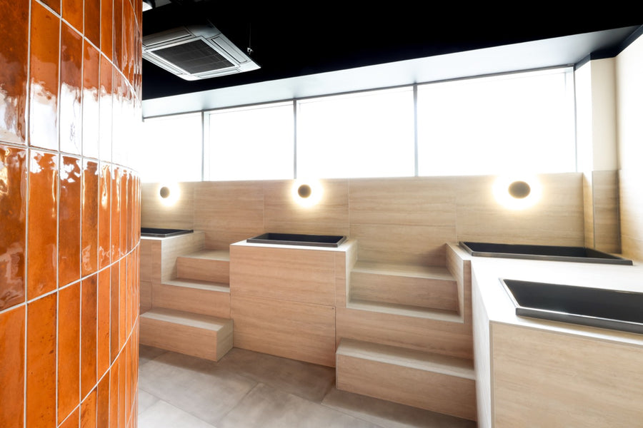 Plunge tubs along the glass-brick wall