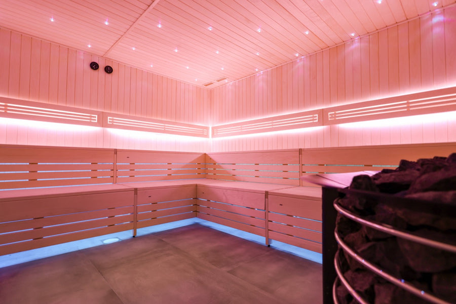Colour-LED sauna with lava heater and log wall
