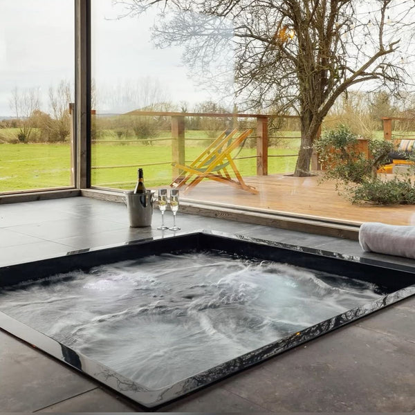 Omnitub 1600 x 1600 deep soaking tub 600mm depth extra large square - side angle