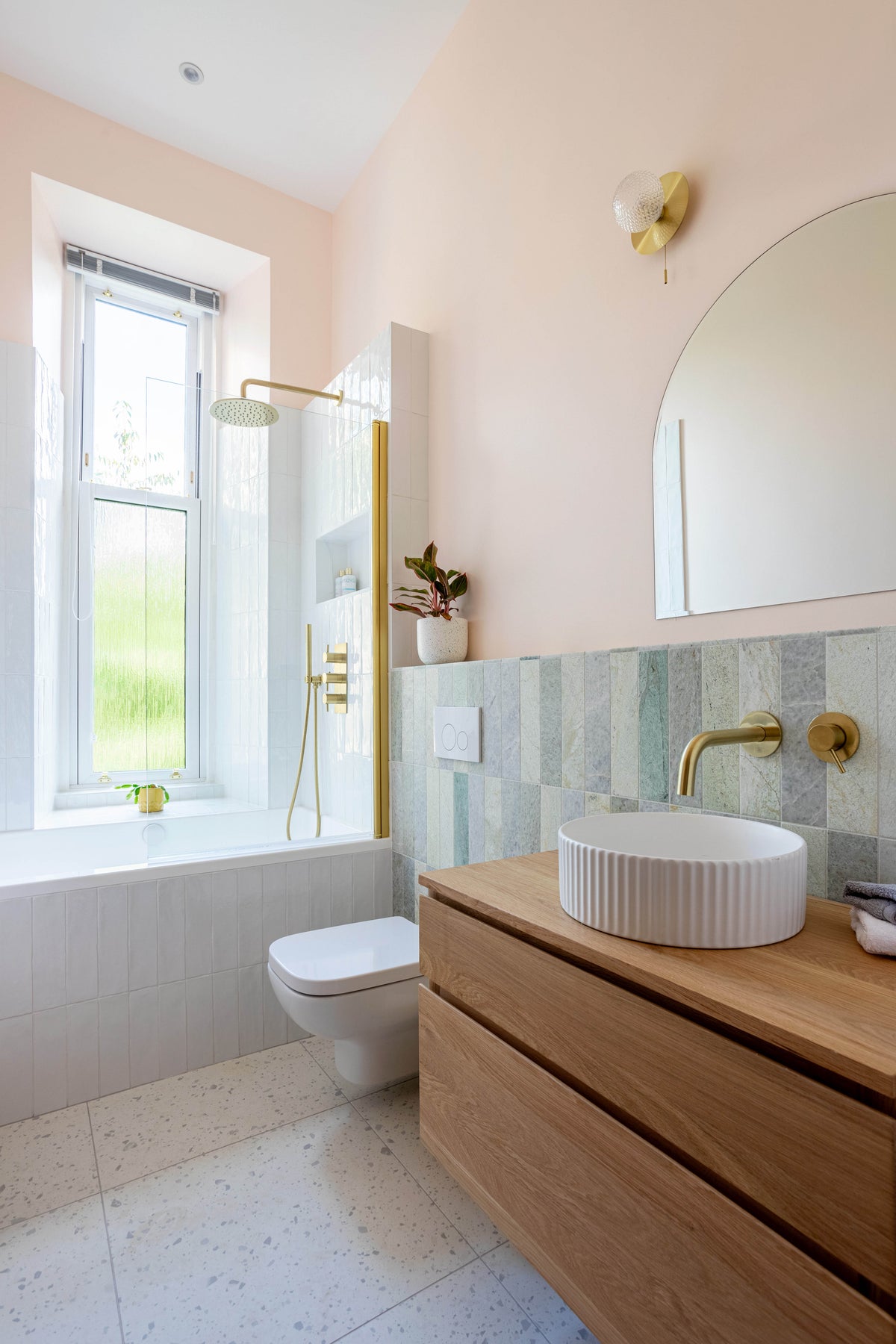 Colour-styled bathroom with Omnitub bath and brass fittings