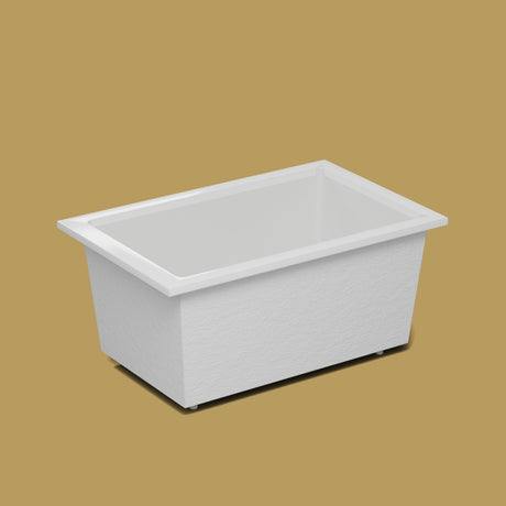 1400 x 900 Deep Soaking Tub – 600mm Depth – Rectangular – Omnitub — side three-quarter on the feet kit [render:ext3q:feet] [bg:brass]